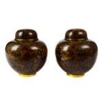 A pair of modern Chinese cloisonné vases and covers, of ovoid form, the cloisonné of dark brown