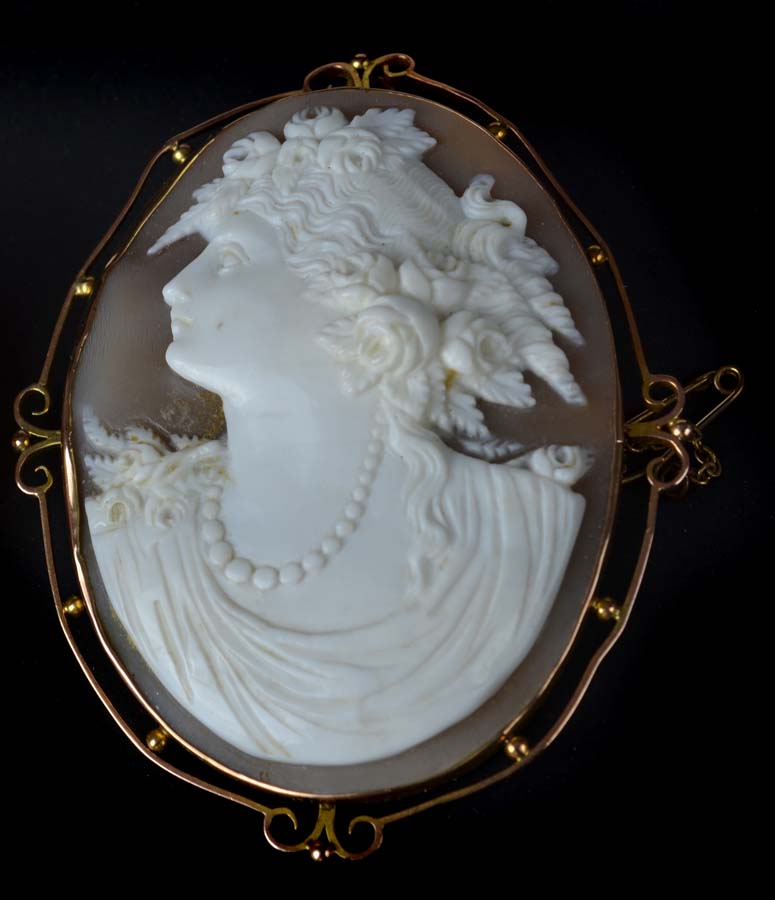 An antique shell cameo gold mounted brooch, c1890, the cameo well carved with the profile of a