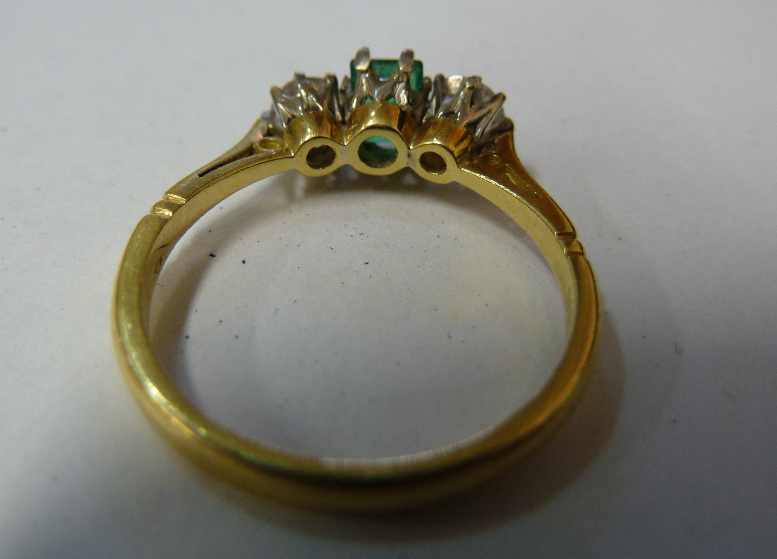 An emerald and diamond three stone ring, c1960, the rectangular shaped emerald flanked either side - Image 3 of 4