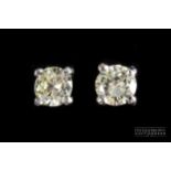 A pair of brilliant cut diamond single stone ear studs, weighing 0.5ct total weight, claw set in