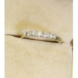 A five stone cubic zirconia ring set in 9ct yellow gold, ring size Q