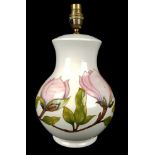 A large Moorcroft Pottery lamp base in Magnolia pattern, tubelined with pink flower stems on a