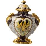 An English pottery vase and cover formed of three swans with wings extended on lion paw feet, gilded