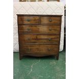 An early 20thC chest of drawer, two short over three long on bracket feet, brass handles and