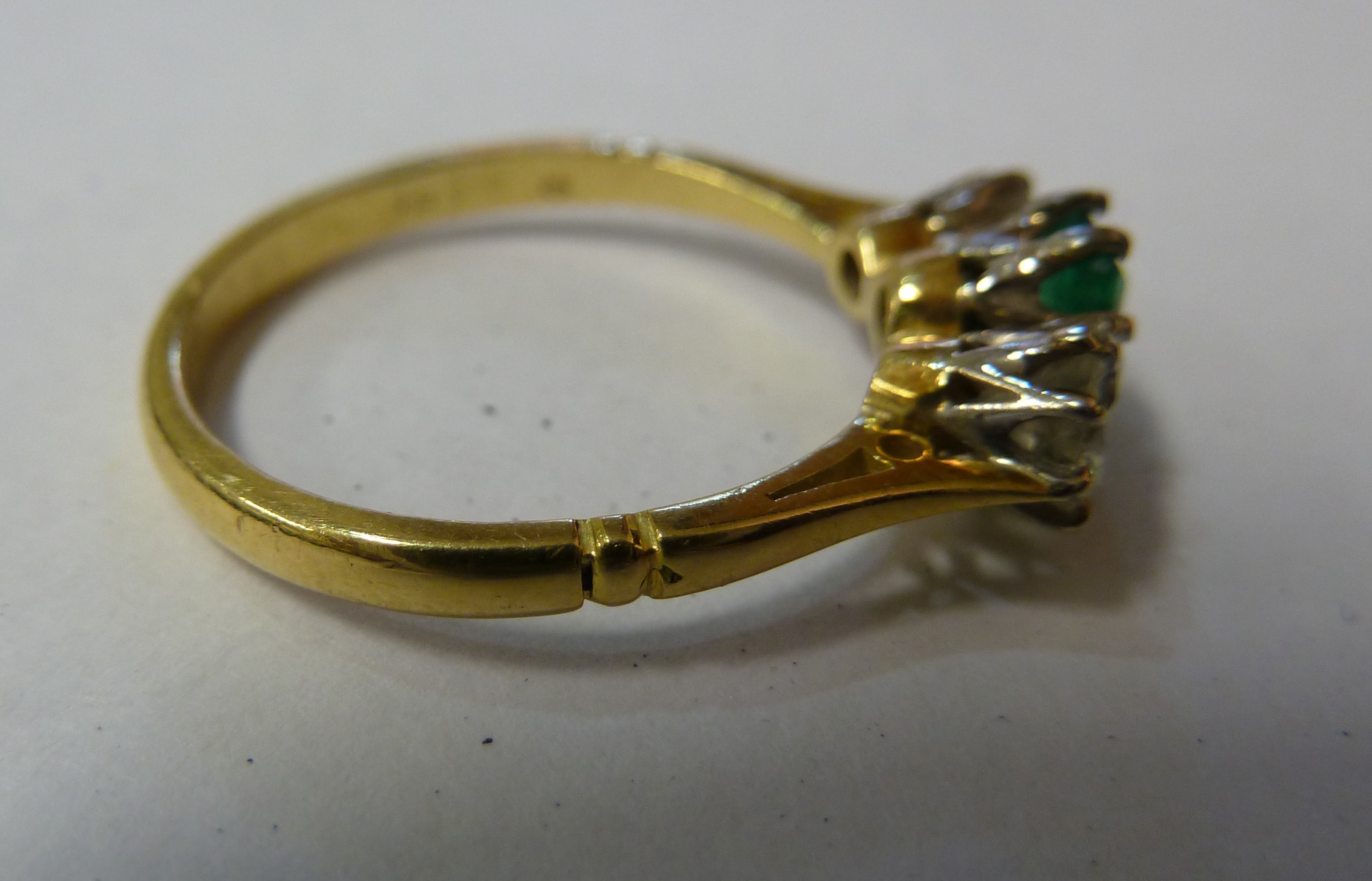 An emerald and diamond three stone ring, c1960, the rectangular shaped emerald flanked either side - Image 4 of 4