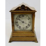 A late 19thC Architectural cased mahogany bracket clock, silvered dial beneath foliate scroll arched