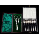 A pair of silver grape scissors, cased, Sheffield 1897, makers mark J.D&S for James Dixon and