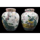 A pair of Chinese porcelain style pot pourri jars and covers with internal covers, probably