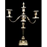 A Sheffield plated three light candelbra with scrolled arms, on single stick base, the central light