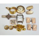 A small scrap 9ct gold wrist watch; a 9ct gold and split pearl 'm' slide; a gem set brooch;