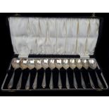 A set of twelve silver scallop shell bowl fruit spoons, in fitted case, Sheffield 1932, makers