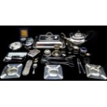 A quantity of silver plated wares includes a flatware part canteen, teapot, tureen cover and