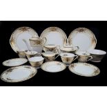 A Noritake Japanese porcelain tea/coffee service, pale cream ground borders gilded with foliate