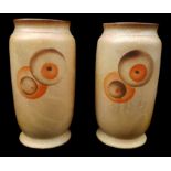 A pair of French pottery Art Deco vases, tapered cylindrical form, with concentric circle motifs