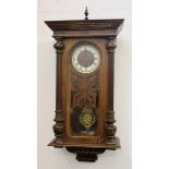 A Vienna regulator clock, the pale cream dial decorated with red foliate spandrels between black