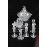 Five cut glass candlesticks, one marked Stuart; and two cut glass posy baskets (7)