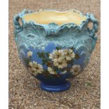 An exceptionally large Pottery jardiniere, probably Burmantoft Faience, the globular bowl moulded