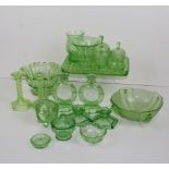 A collection of Art Deco moulded green glass dressing table and serving wares, includes