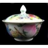 A Chinese porcelain miniature bowl and cover, the domed cover with bud finial, decorated in