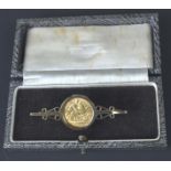 A half sovereign dated 1912, mounted as a bar brooch, 7grs approx.