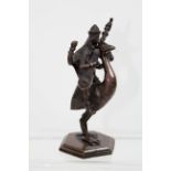 An Indian or Sino Tibetan bronze of a deity riding a bird whilst playing a sitar possibly Sareswati,