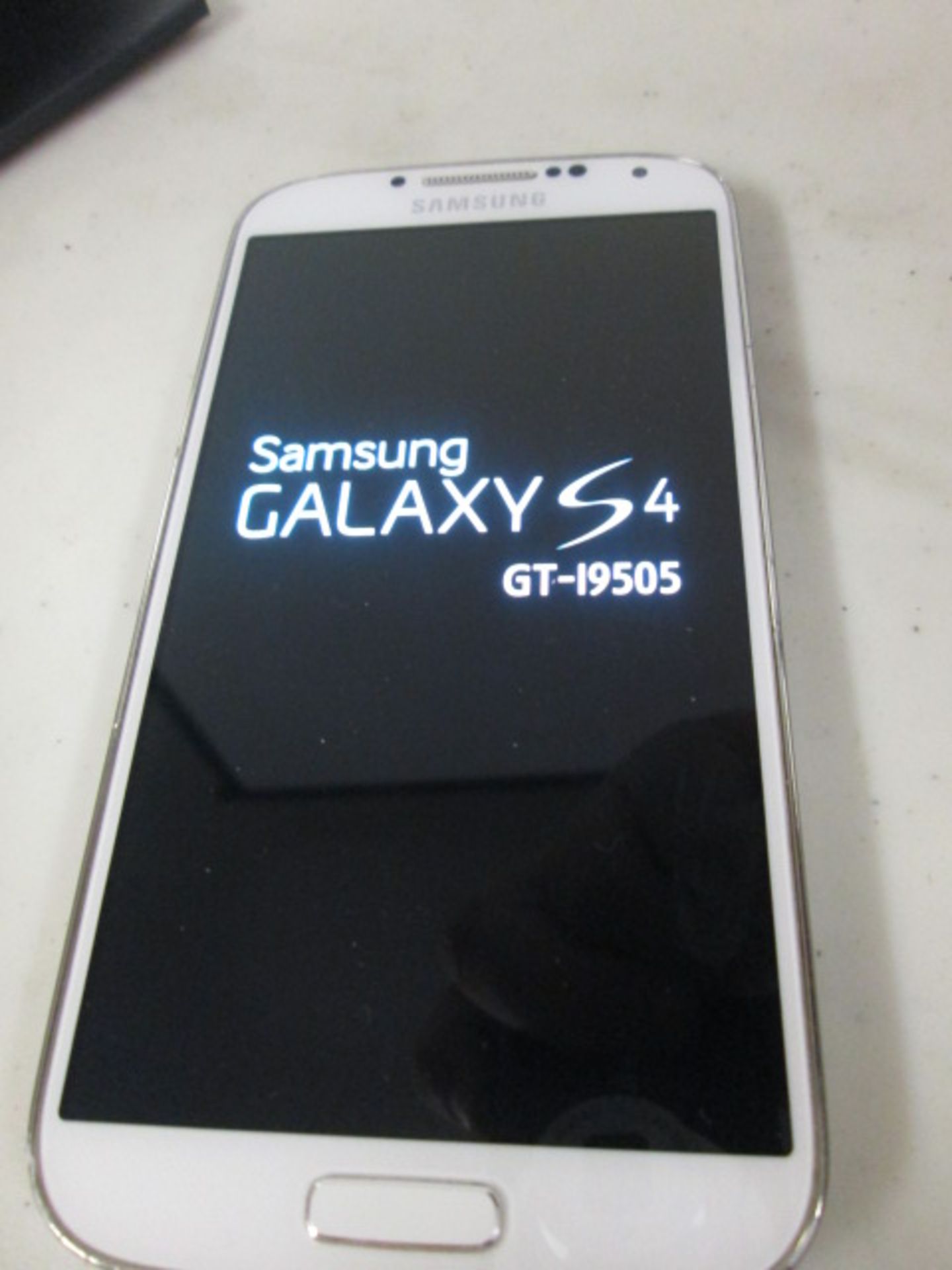 Samsung Galaxy S4 Mobile Phone, Model GT-19505, 16GB. Colour White. Comes with Charger. Locked to