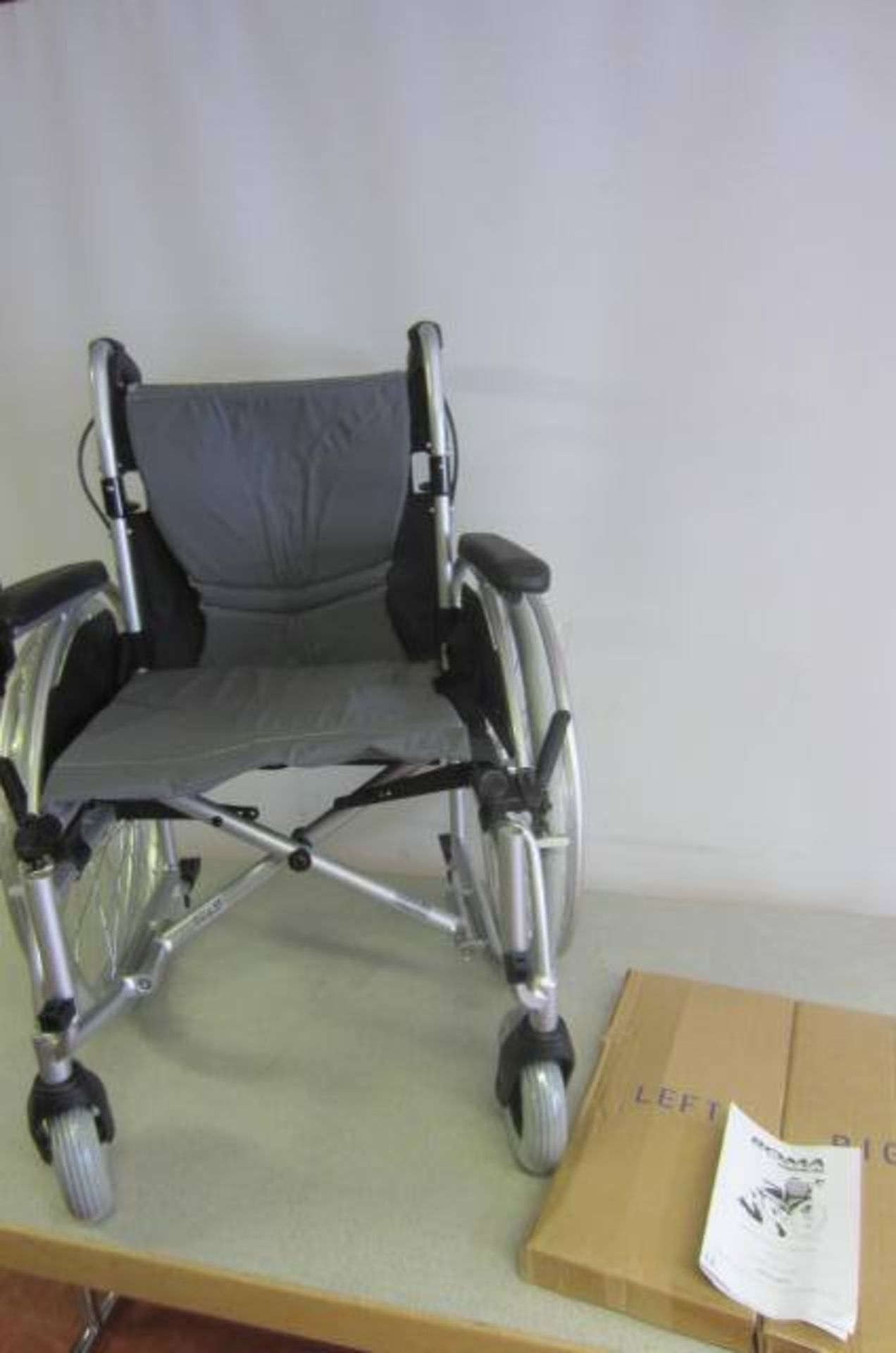 Roma Medical Orbit Light Weight Wheel Chair, Model 1300. In Box As New. RRP £279.00