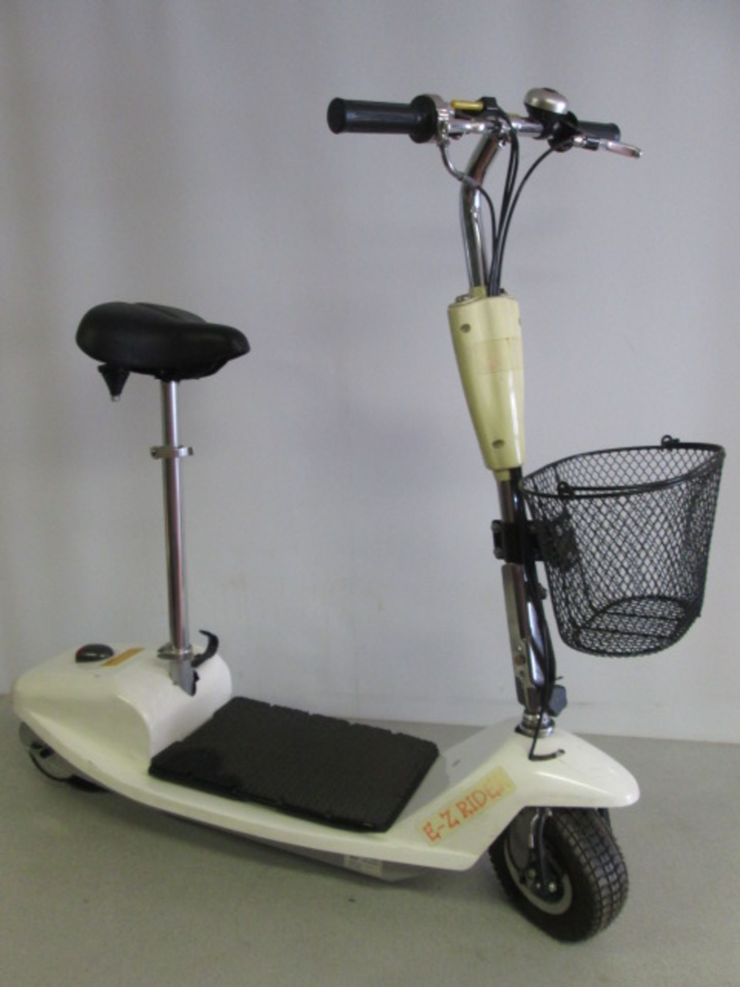 E Z Rider Electric 2 Wheel Mini Scooter. Comes with Battery Charger which Requires Adapter &