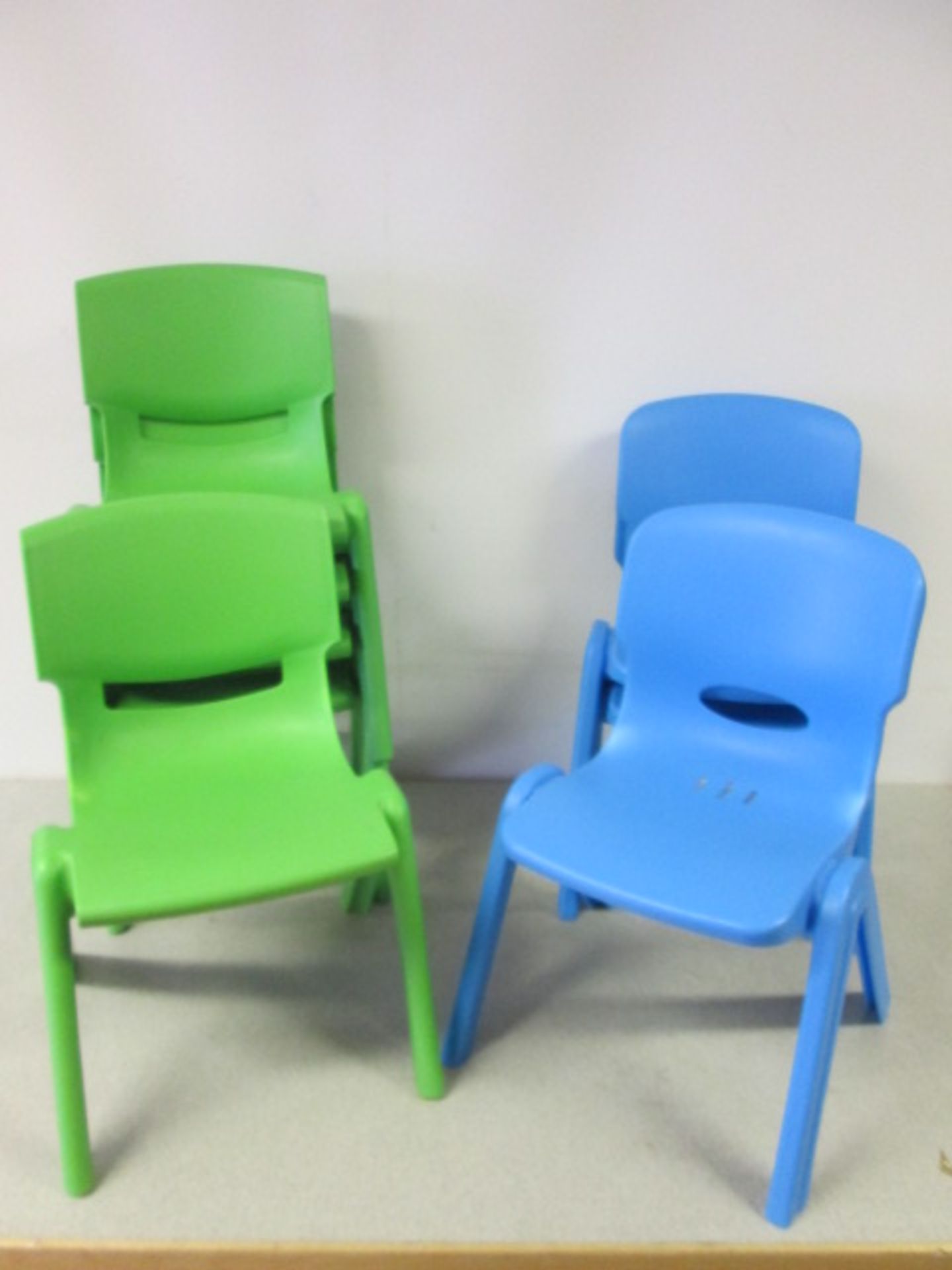 14 x Plastic Children's Classroom Stacking Chairs, 9 x Green/3 x Blue/2 x Red. Size (H) 52cm x (W)