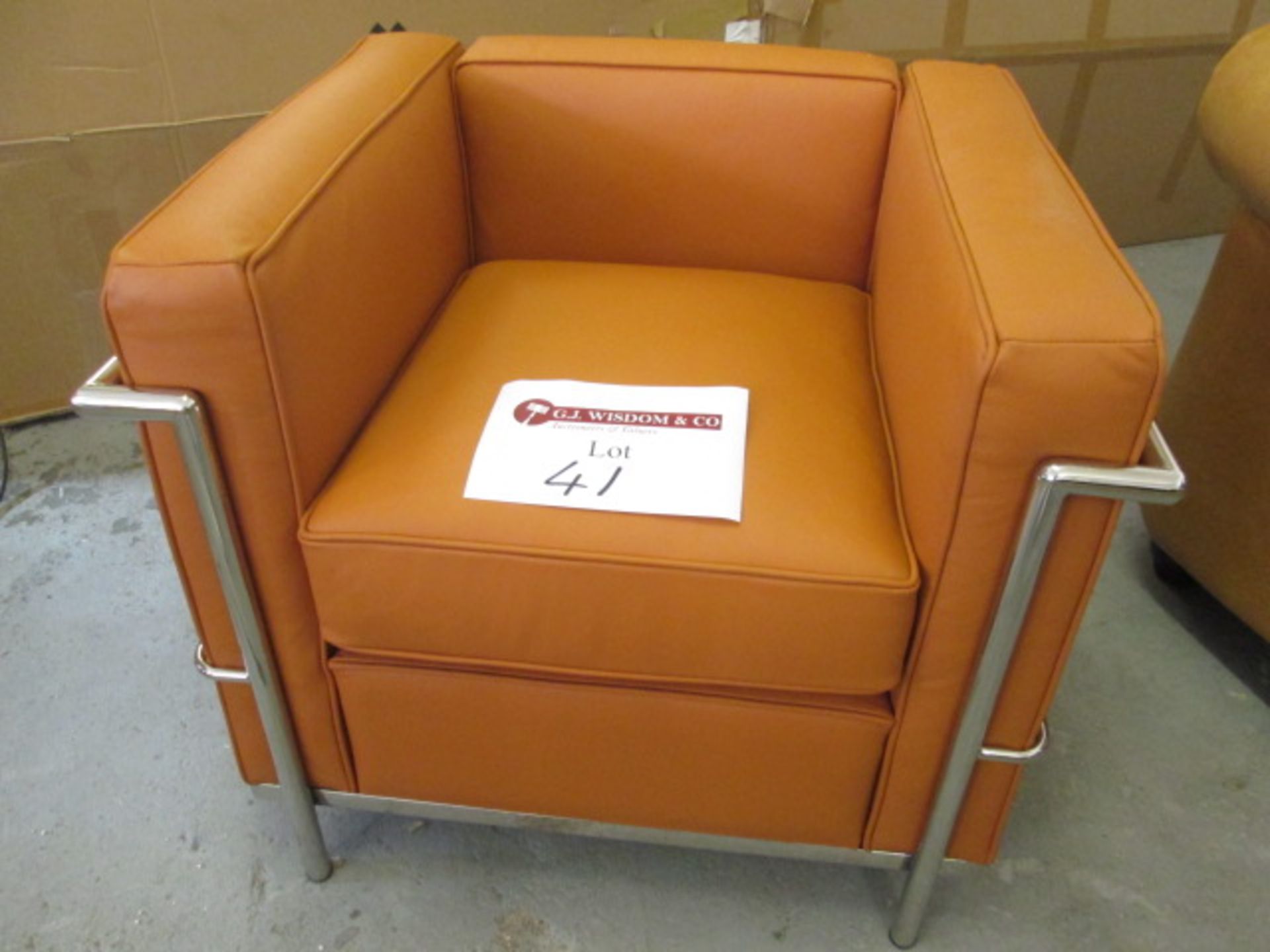As New/Ex Dipslay - Chrome Framed Armchair in Tan Leather.
