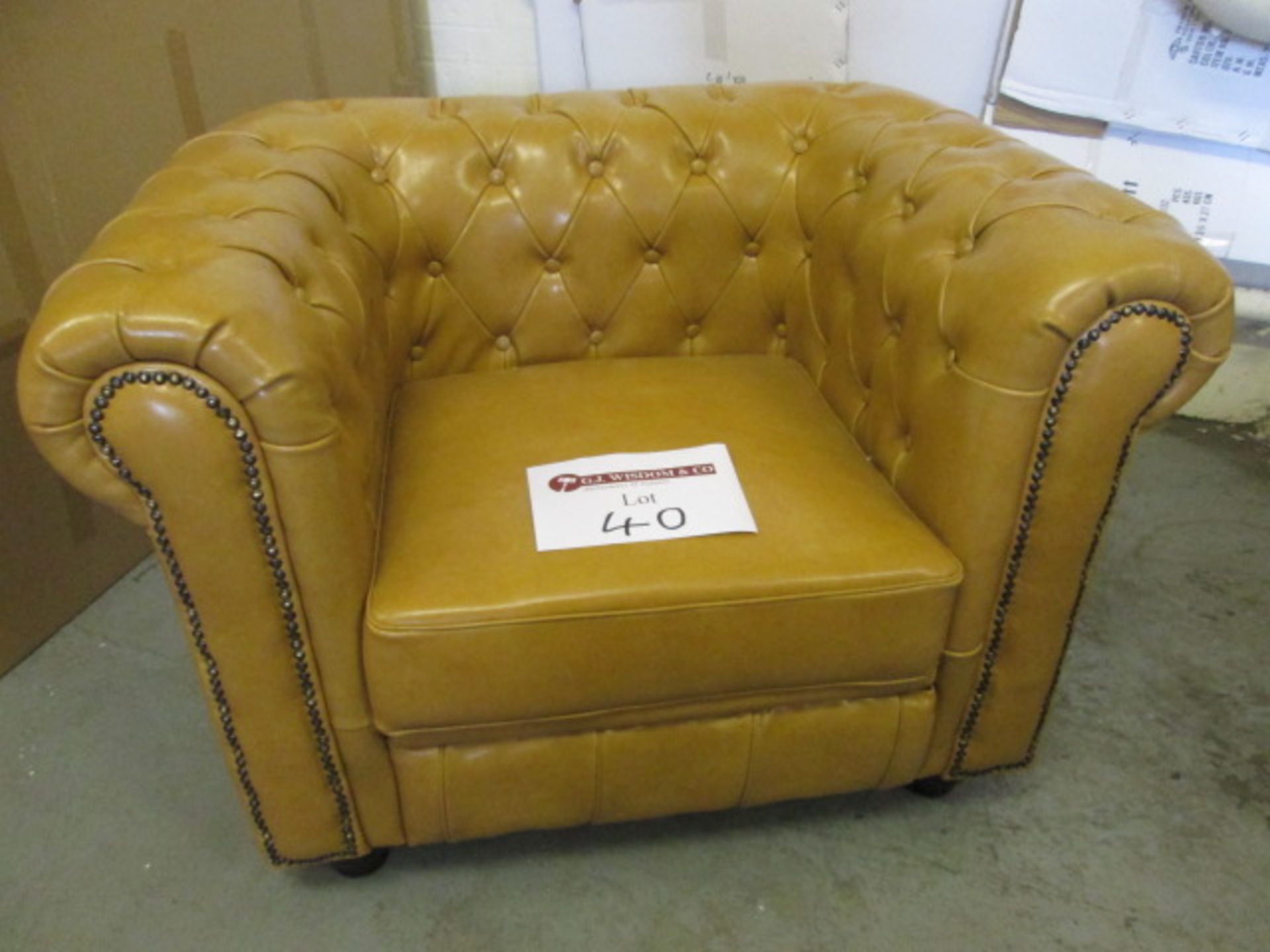 As New/Ex Display - Chesterfield Style Armchair in Tan Leather with Wooden Feet.