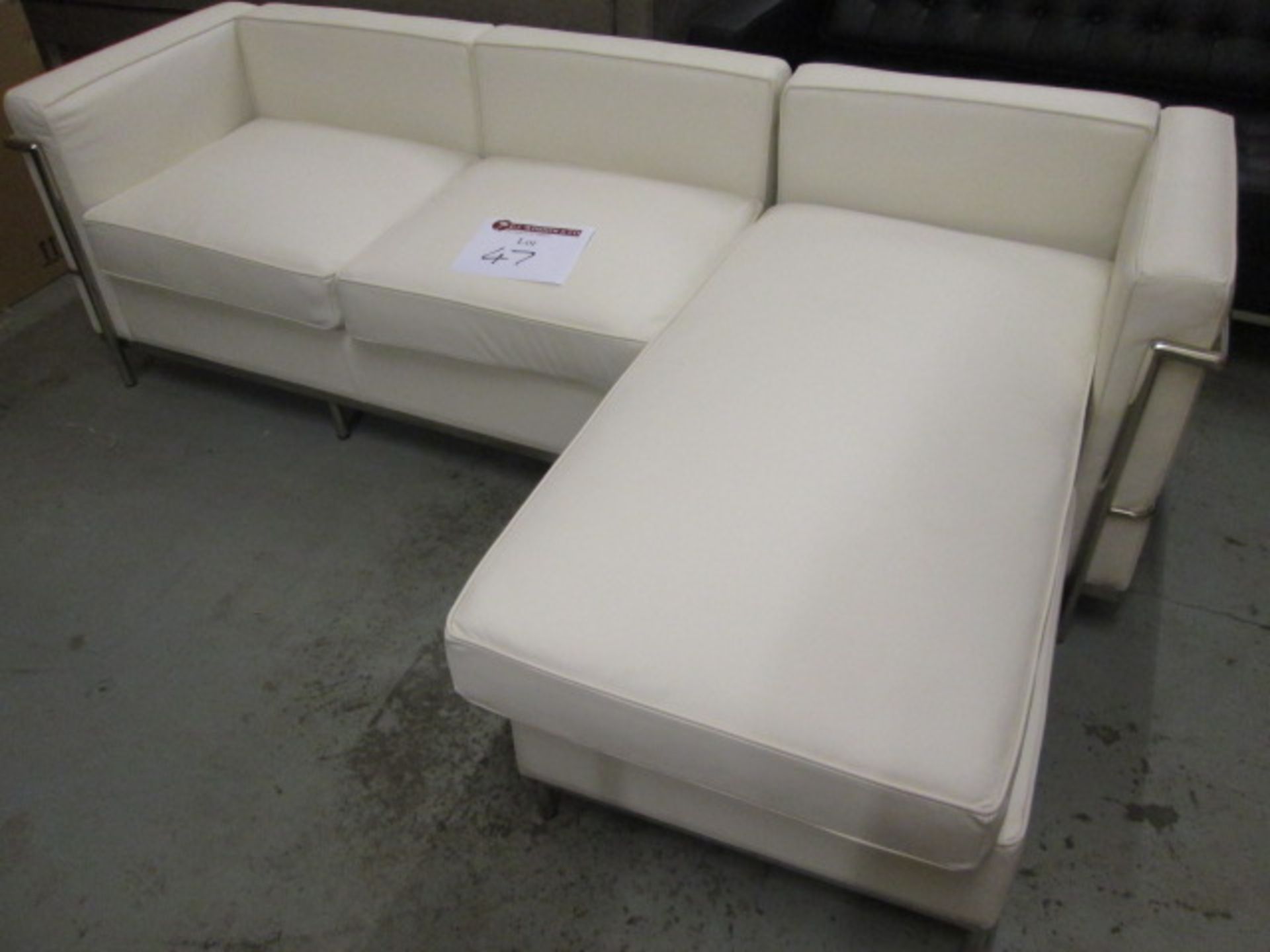 Boxed/As New - Chrome Framed Cream Leather Sofa with Chaise Lounge (2 x Boxes Model TS-S930-L). Size