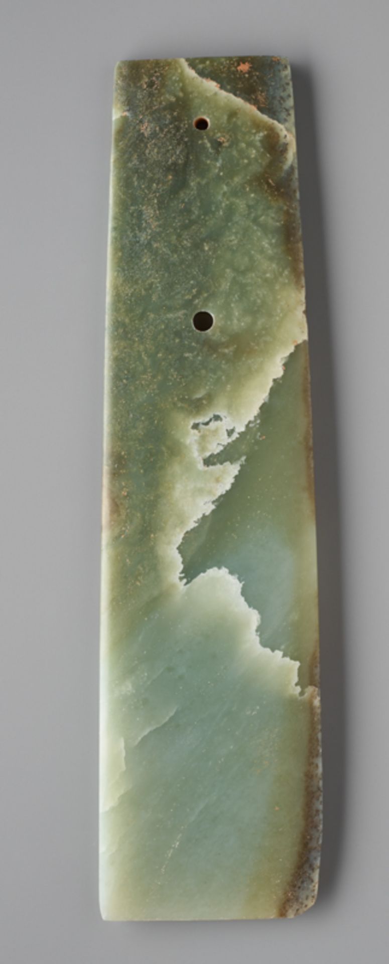 LONG CHISEL-SHAPED BLADEJade. China, Late Neolithic period, Qijia culture, c.2200-1900 BCThis