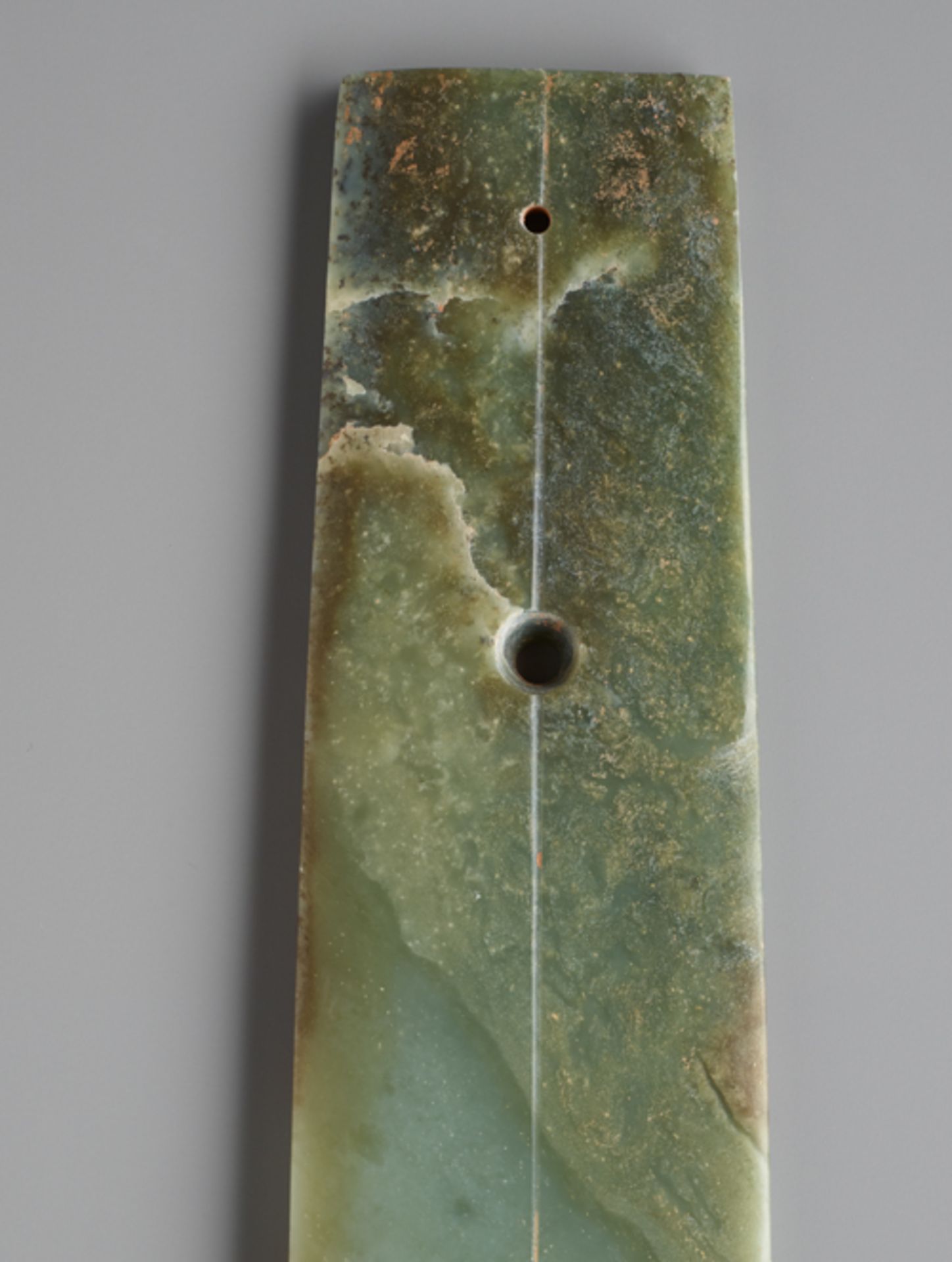 LONG CHISEL-SHAPED BLADEJade. China, Late Neolithic period, Qijia culture, c.2200-1900 BCThis - Image 3 of 6