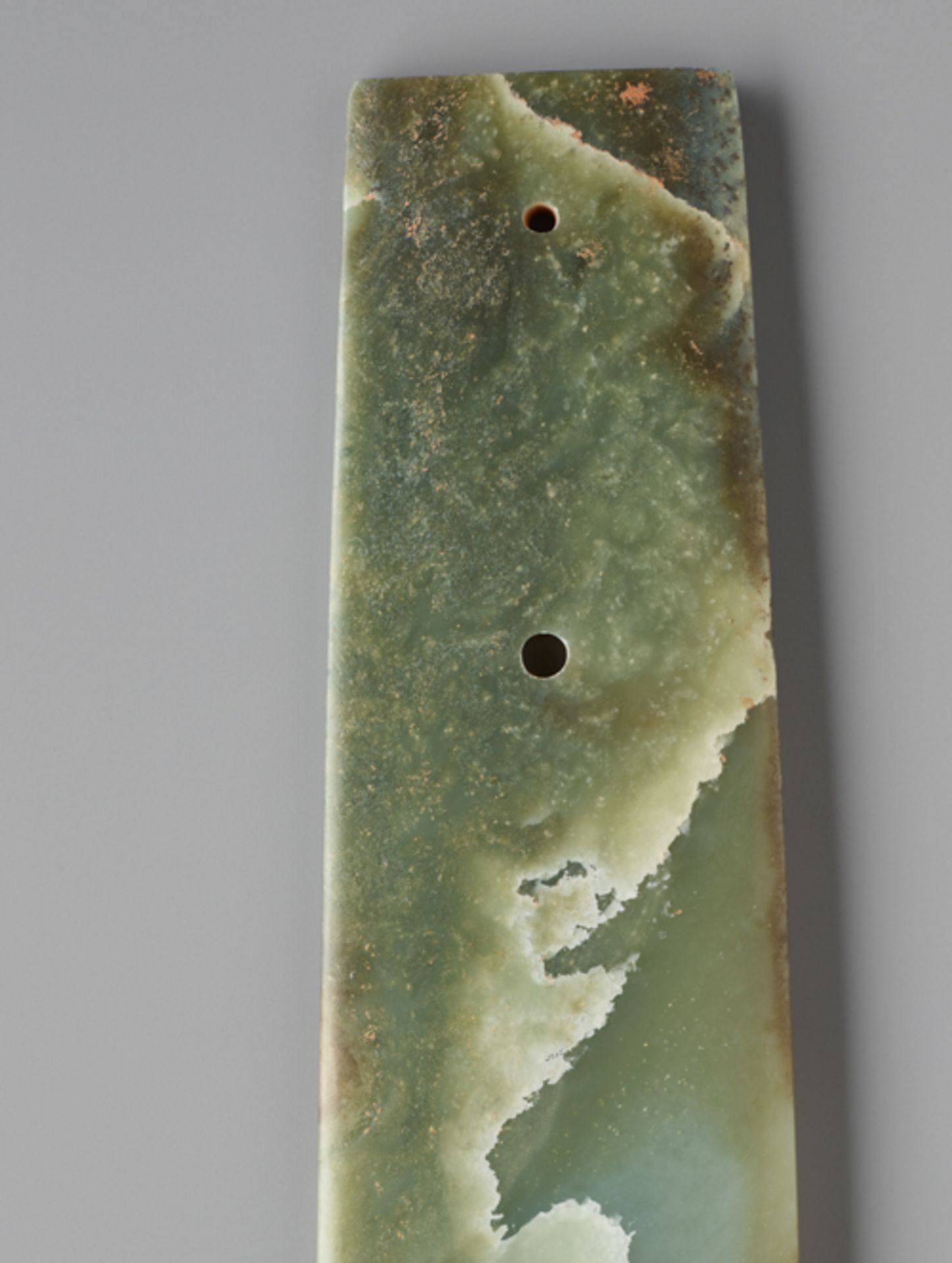 LONG CHISEL-SHAPED BLADEJade. China, Late Neolithic period, Qijia culture, c.2200-1900 BCThis - Image 4 of 6