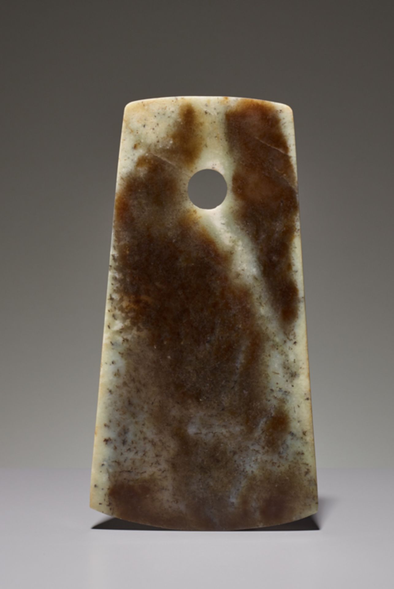 YUE AXEJade. China, Late Neolithic period, Qijia culture, c.2200-1900 BCThis axe has a slightly