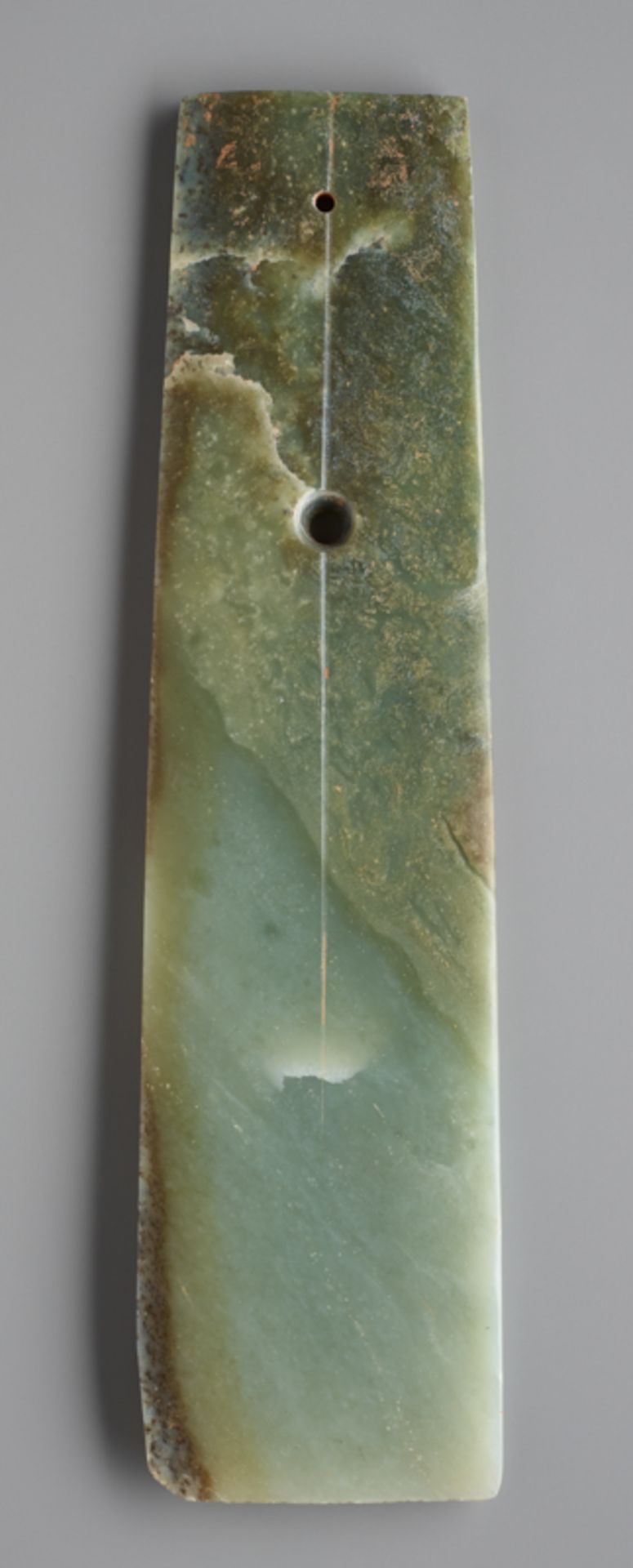 LONG CHISEL-SHAPED BLADEJade. China, Late Neolithic period, Qijia culture, c.2200-1900 BCThis - Image 2 of 6