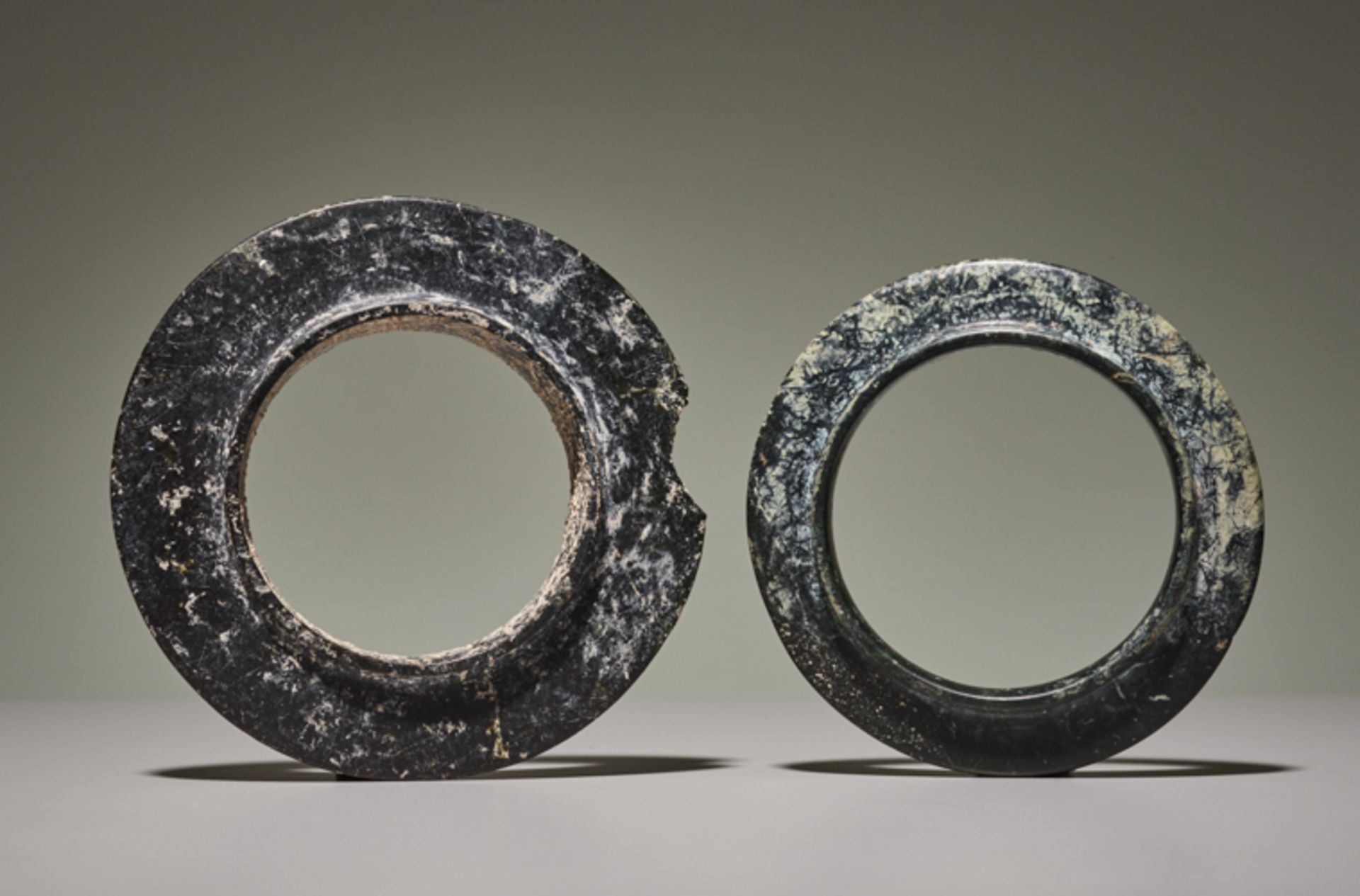 PAIR OF COLLARED YUAN RINGSJade. China, Late Shang dynasty, ca. 1200 BCThe two collared rings in the