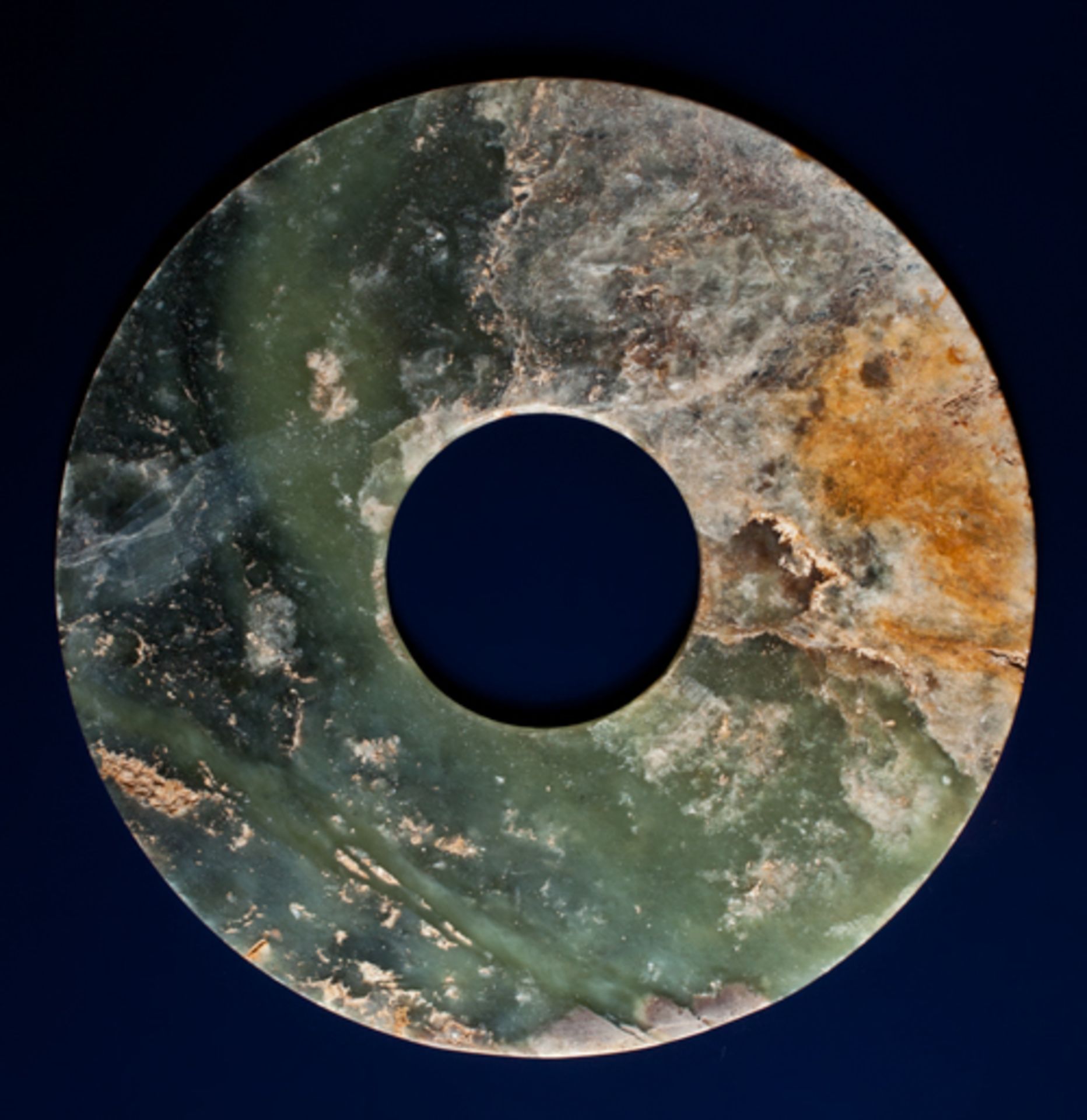 BI DISCJade. China, Late Neolithic period, early Bronze age, c.2000 BCThis fine disc is carved