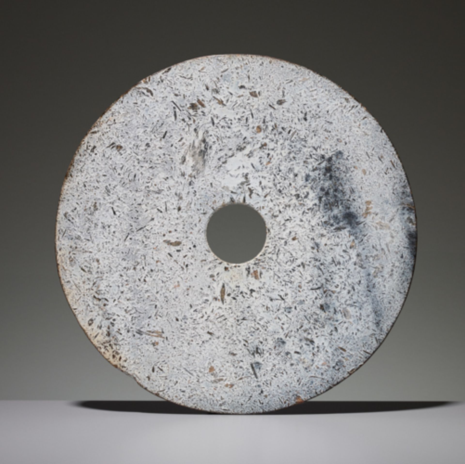 BI DISC Jade. China, Late Neolithic period, early Bronze age, c. 2000 BC This large bi disc has such