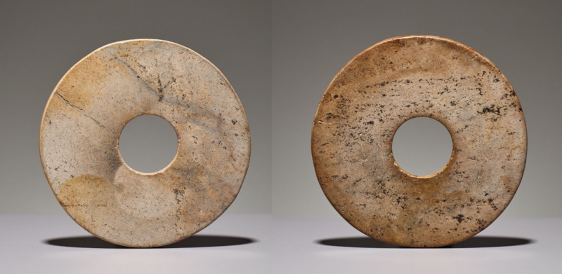 PAIR OF SMALL DISCSJade. China, Late Neolithic period, early Bronze age, c.2500-2000 BCPair of small