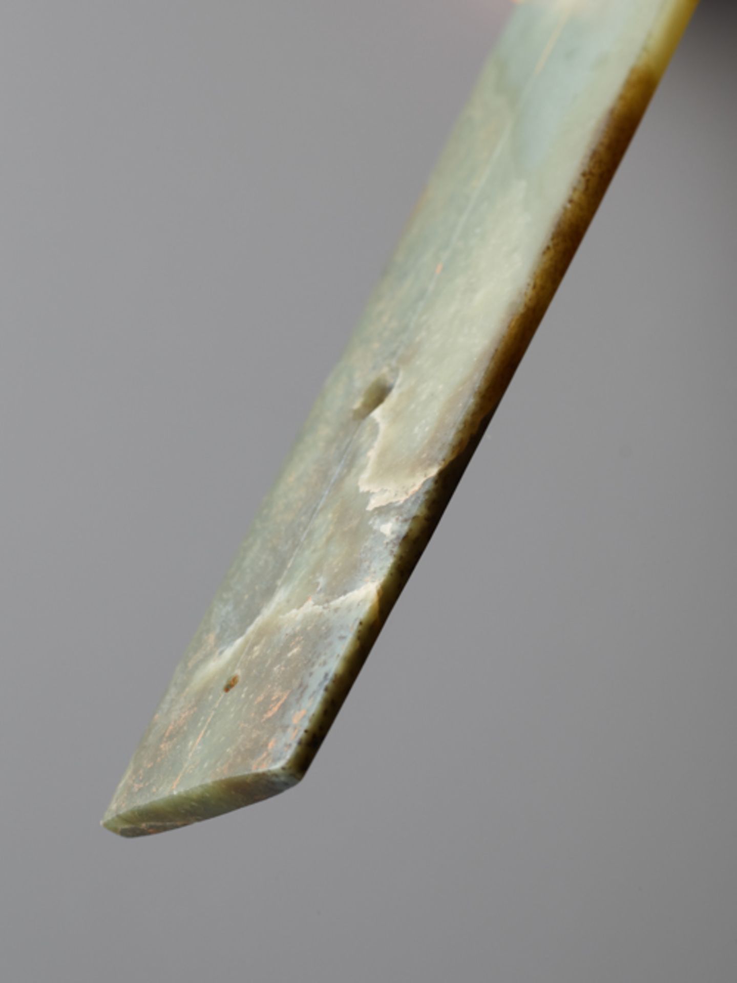 LONG CHISEL-SHAPED BLADEJade. China, Late Neolithic period, Qijia culture, c.2200-1900 BCThis - Image 6 of 6
