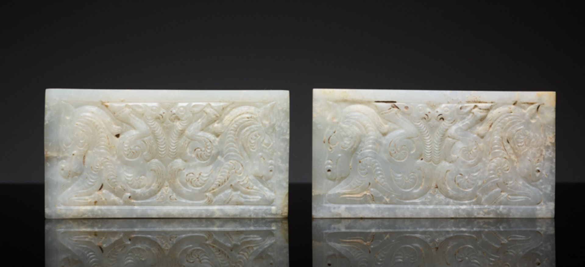 PAIR OF PLAQUES IN WHITE JADE IN THE STYLE OF THE STEPPEJade. China, Early Western Han period, 2nd –