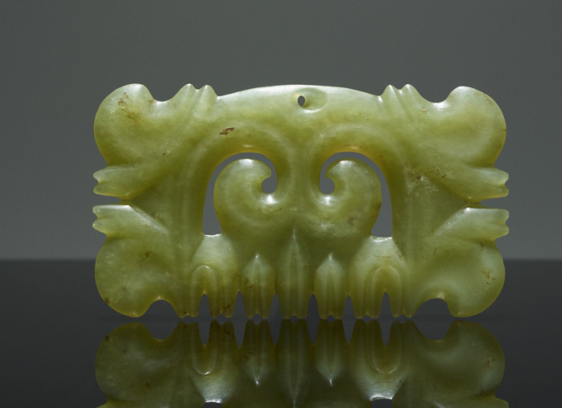 PENDANT WITH MASK MOTIFJade. China, Hongshan culture, c.3500-3000 BCThis small rectangular - Image 2 of 4