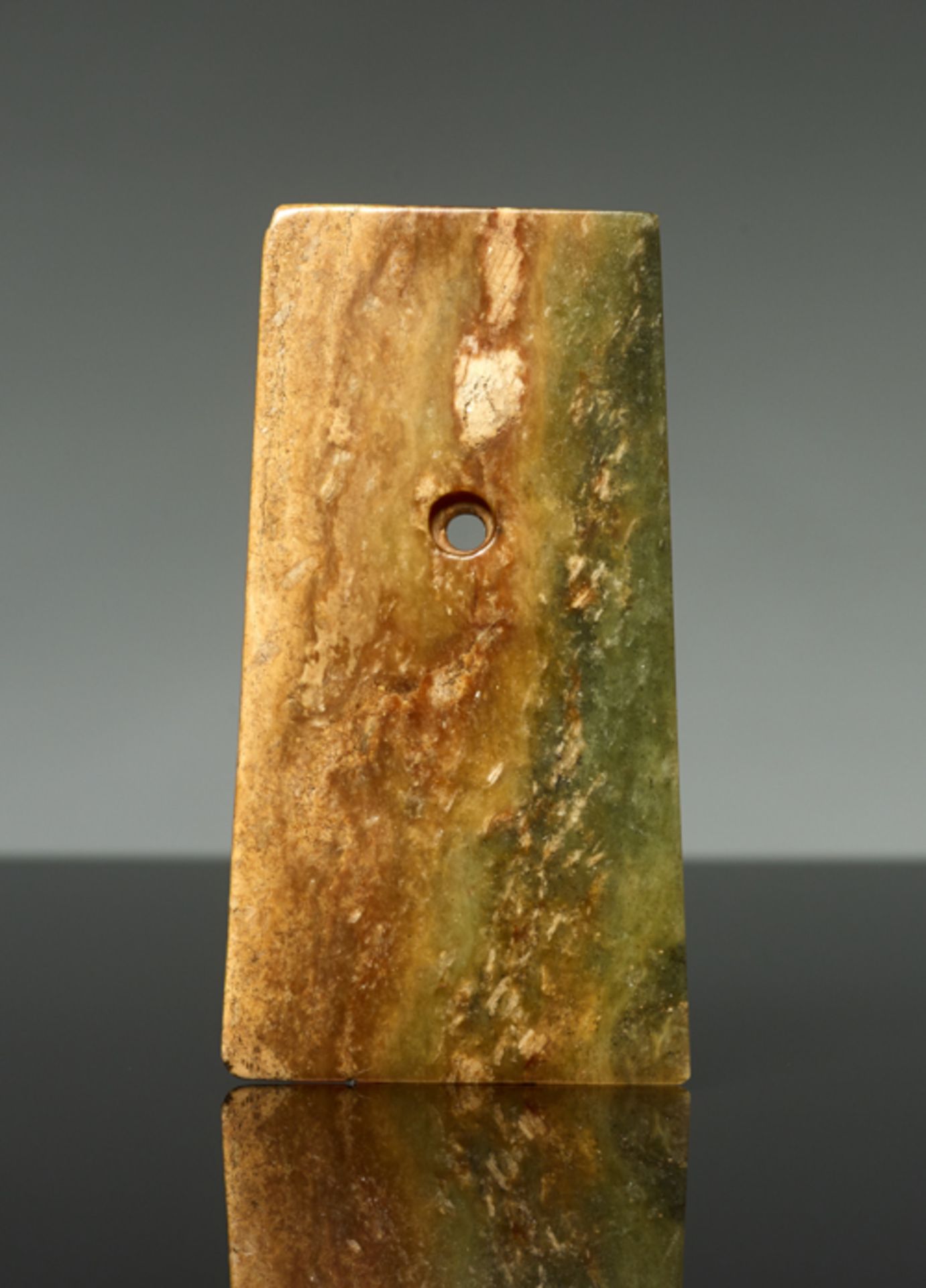 AXE-SHAPED PENDANTJade. China, Late Neolithic period, early Bronze age, c.2500-2000 BCThis small