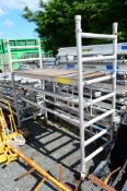 Aluminium fold up wheeled scaffold platform as photographed comprising of: fold up end frames, 3