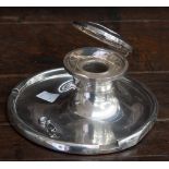 A silver capstan inkwell and combined pen tray,