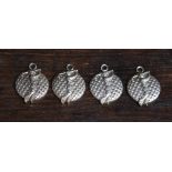 A set of four silver golfing medallions,