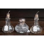 A pair of George V silver topped glass bitters bottles,