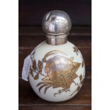 A Victorian silver gilt mounted ovoid scent bottle, opaque glass body with raised gilt decoration,